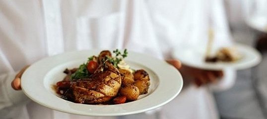 Hot lunch dishes prepared by Lina's Catering